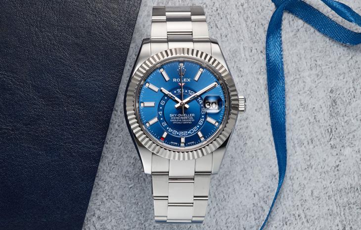 Rolex Sky-Dweller with blue dial, fluted bezel, and oyster bracelet
